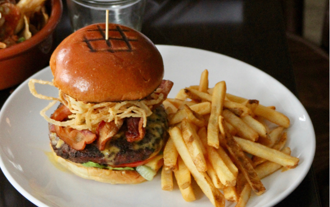 A plate of burger coupled with french fries