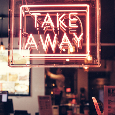A neon sign saying take away